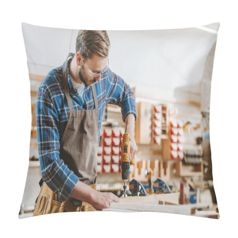 Personality  Selective Focus Of Bearded Carpenter In Goggles And Apron Holding Hammer Drill Near Wooden Planks Pillow Covers