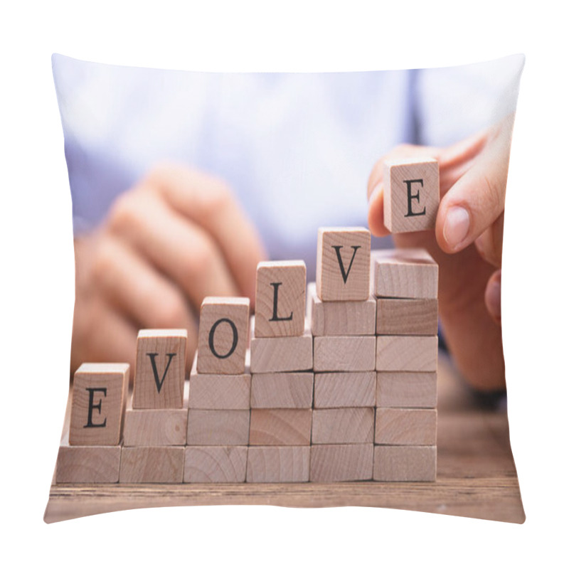 Personality  Close-up Of Person's Hand Placing Last Alphabet Of Word Evolve On Wooden Block Pillow Covers