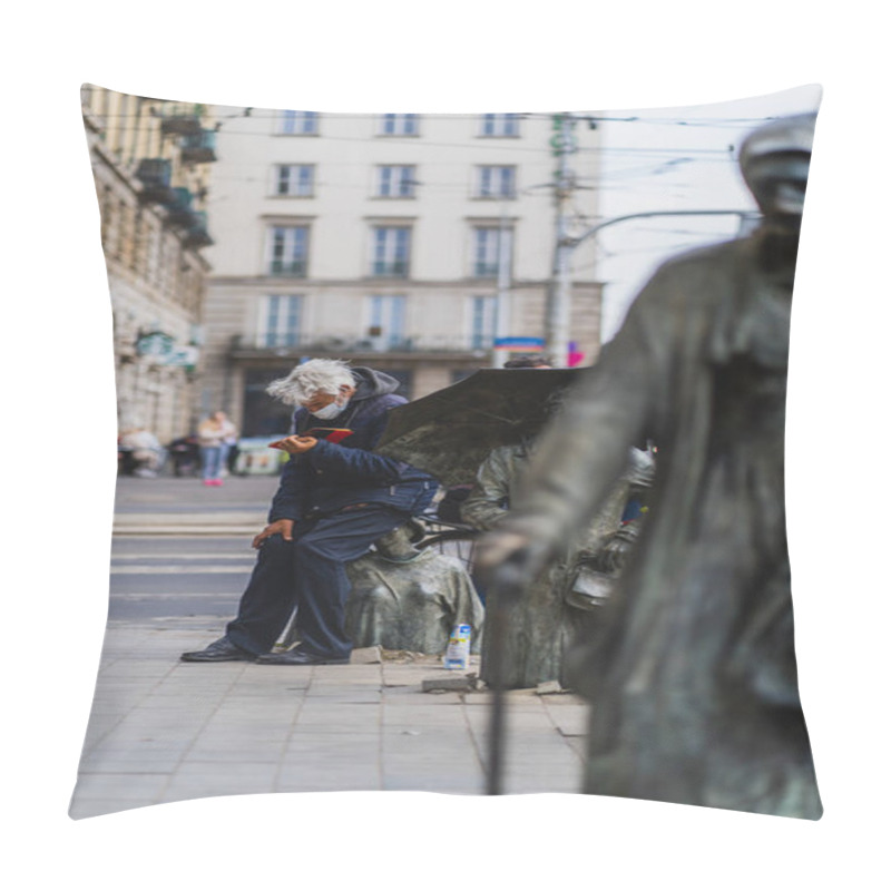 Personality  WROCLAW, POLAND - APRIL 18, 2022: Man Reading Book Near Anonymous Pedestrians Memorial On Urban Street  Pillow Covers