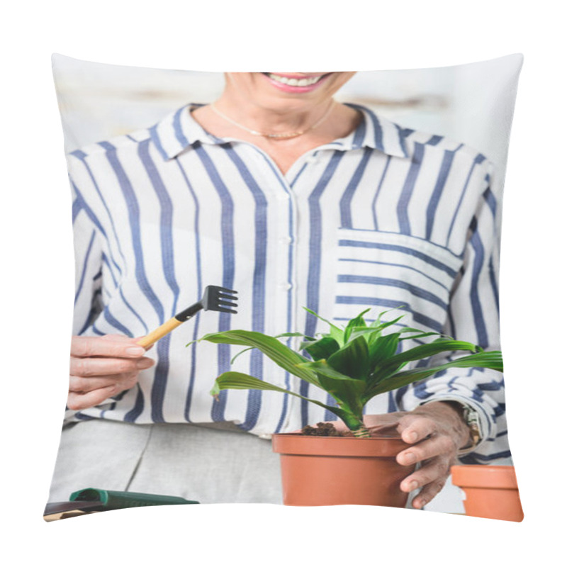 Personality  Cropped Shot Of Smiling Senior Woman Cultivating Houseplant At Home Pillow Covers