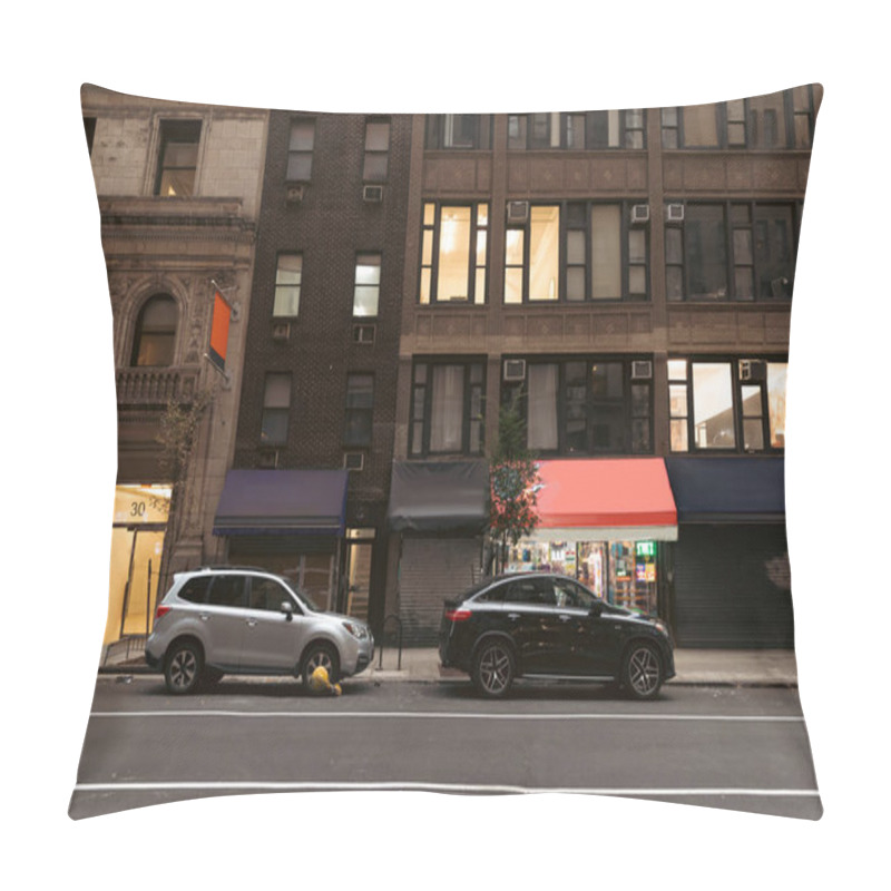 Personality  NEW YORK, USA - OCTOBER 13, 2022: Cars Near Buildings With Shops On Road Of Urban Street  Pillow Covers