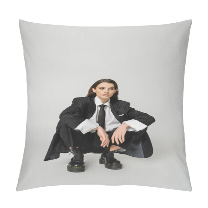 Personality  Young Model In Black Oversize Suit And Rough Boots Sitting On Haunches And Looking Away On Grey Background Pillow Covers