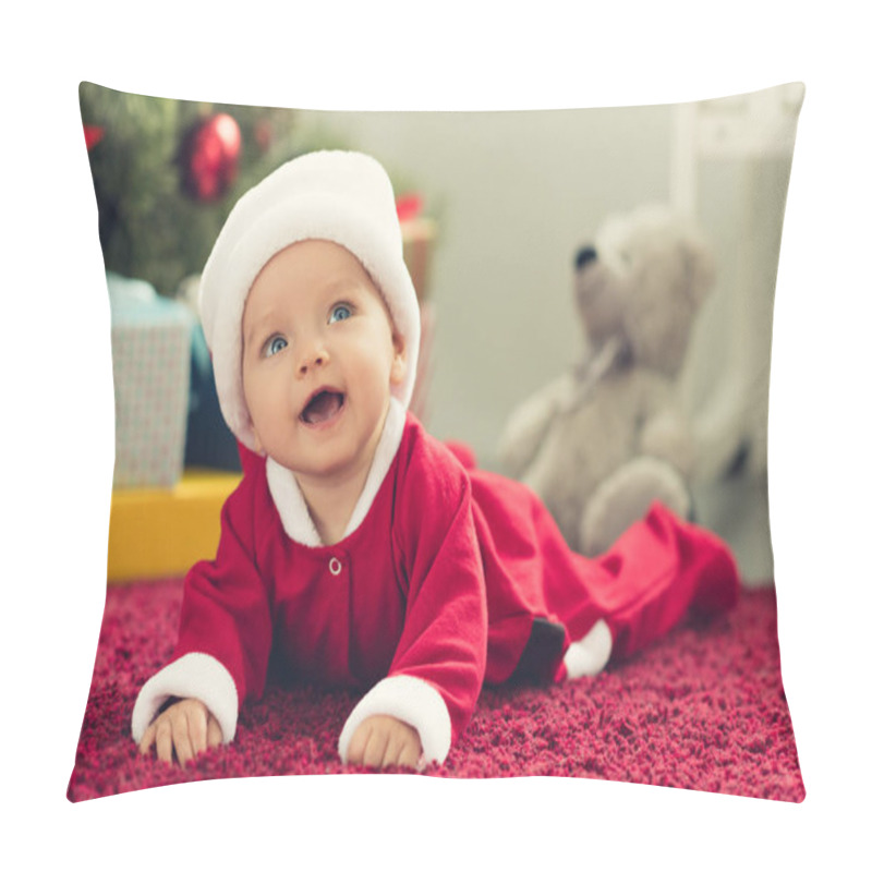 Personality  Close-up Portrait Of Adorable Little Baby In Santa Hat With Blurred Christmas Tree And Gifts On Background And Looking Up Pillow Covers