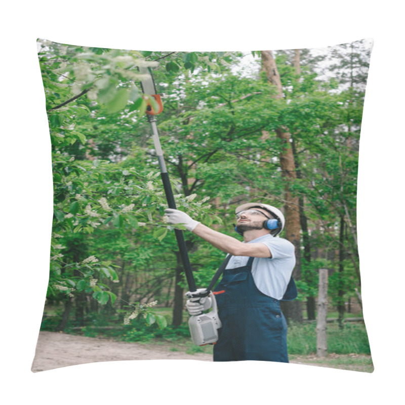 Personality  Gardener In Overalls, Helmet And Hearing Protectors Trimming Trees With Telescopic Pole Saw In Garden Pillow Covers