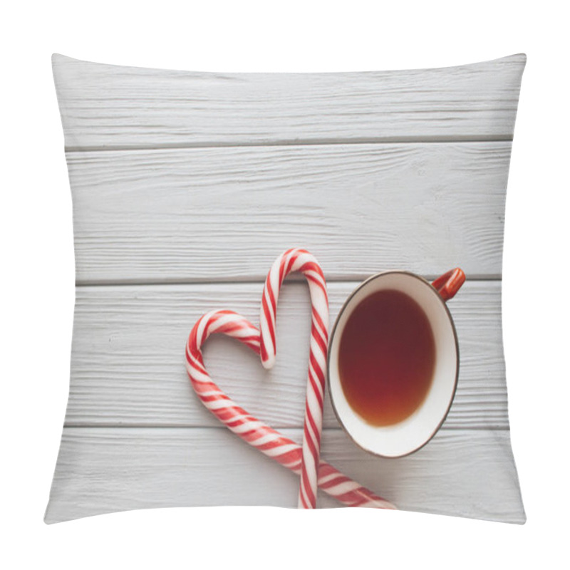 Personality  Christmas Candy Canes In Heart Shape And Cup Of Tea On Wooden Background Pillow Covers