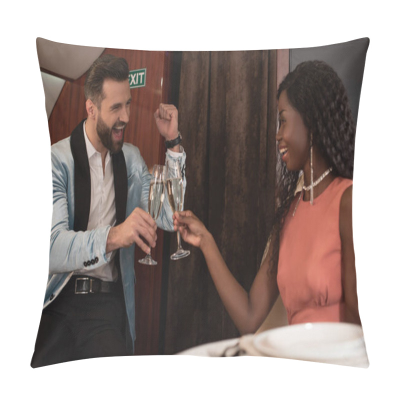 Personality  Excited Man Showing Yeah Gesture While Clinking Glasses Of Champagne With Elegant African American Woman In Plane Pillow Covers