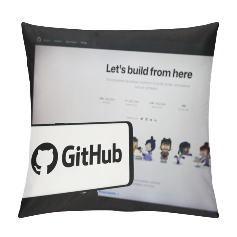 Personality  Stuttgart, Germany - 07-09-2023: Person Holding Mobile Phone With Logo Of US Software Development Company GitHub Inc. On Screen In Front Of Web Page. Focus On Phone Display. Pillow Covers