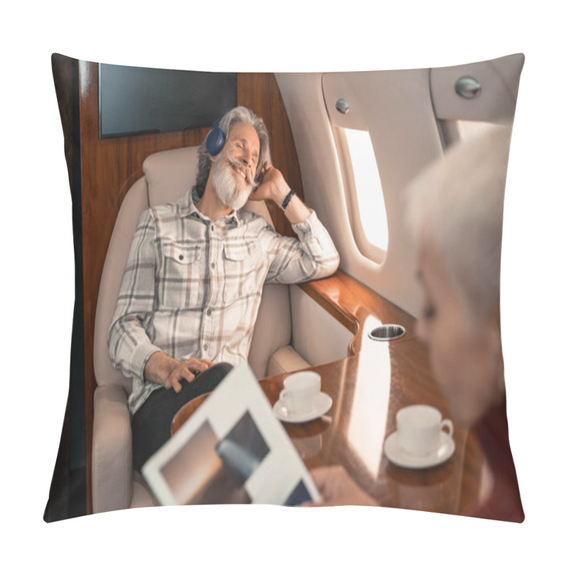 Personality  Smiling Man In Headphones Sitting Near Wife Reading Magazine On Blurred Foreground  Pillow Covers