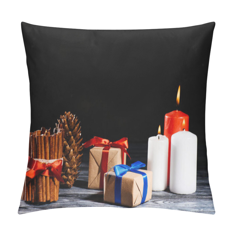 Personality  Close-up View Of Burning Candles, Pine Cone And Christmas Gifts On Wooden Table On Black Pillow Covers