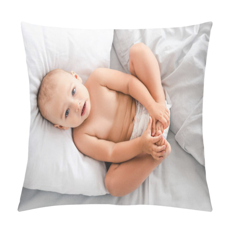 Personality  Top View Of Little Baby In Diaper Laying On Back And Grabbing Feet With Hands And Looking At Camera Pillow Covers