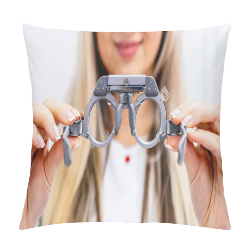 Personality  Close-up Of Ophthalmological Trial Frame And Test Glasses In Woman's Hands. Eysight Correction. Blonde Young Girl Is Holdeng Corrective Spectacles. Pillow Covers