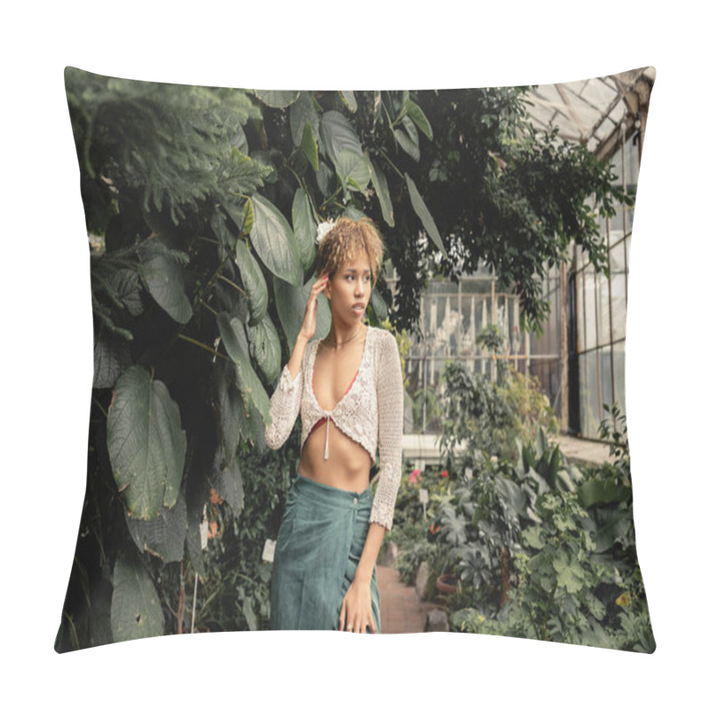 Personality  Confident Young African American Woman In Summer Knitted Top And Skirt Looking Away While Standing Near Plants In Blurred Indoor Garden, Fashion-forward Lady In Tropical Oasis Pillow Covers