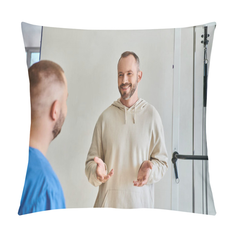 Personality  Happy Bearded Man Gesturing And Talking To Young Specialist In Rehabilitation Kinesiotherapy Center Pillow Covers