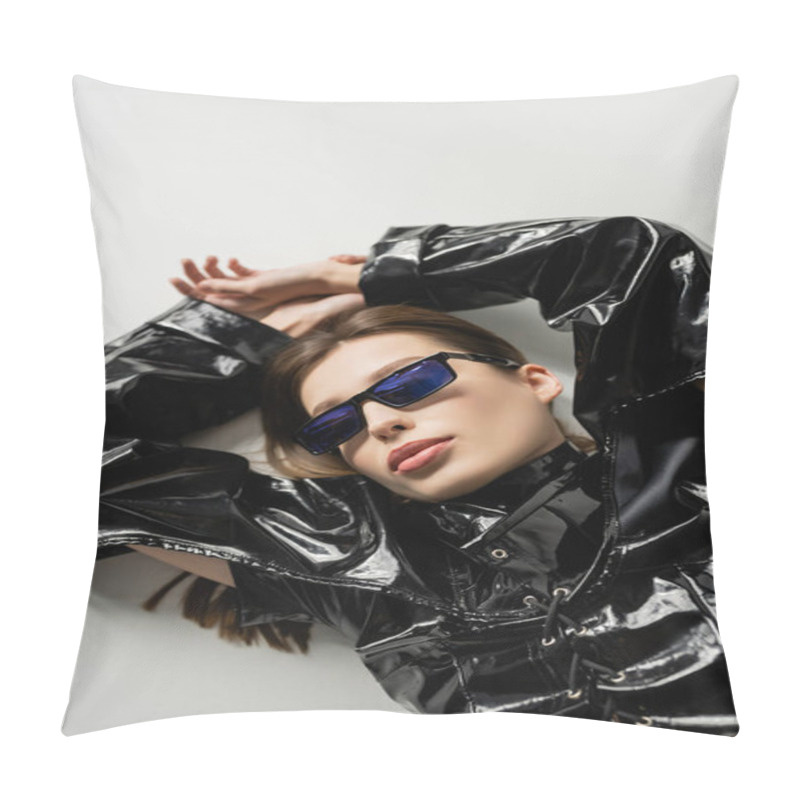 Personality  Top View Of Brunette Woman In Black Latex Jacket And Stylish Sunglasses Lying On Grey Pillow Covers