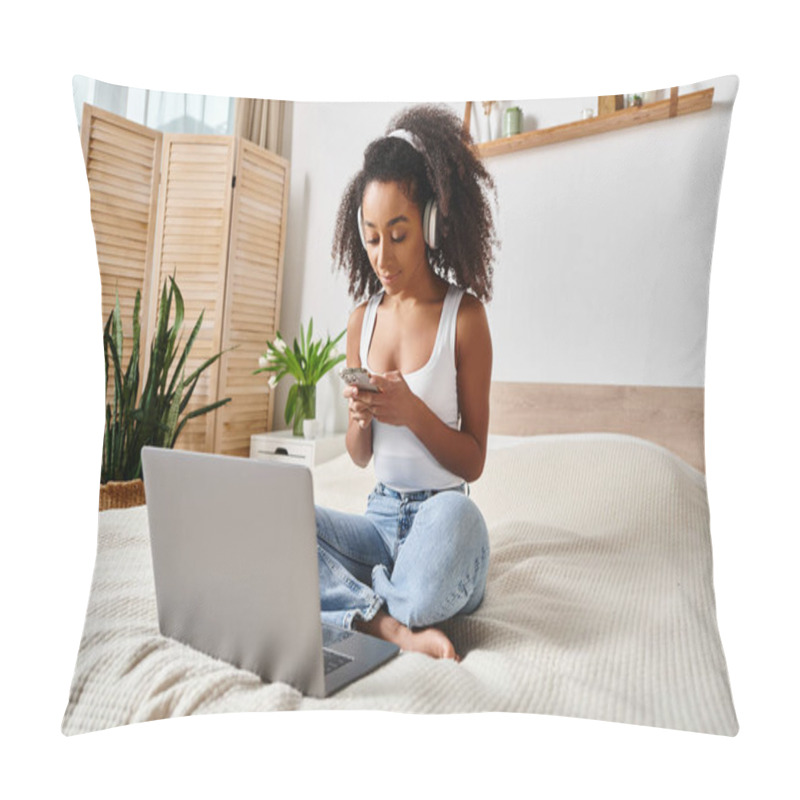 Personality  Curly African American Woman Sitting On Bed, Engrossed In Laptop Screen, In A Modern Bedroom. Pillow Covers