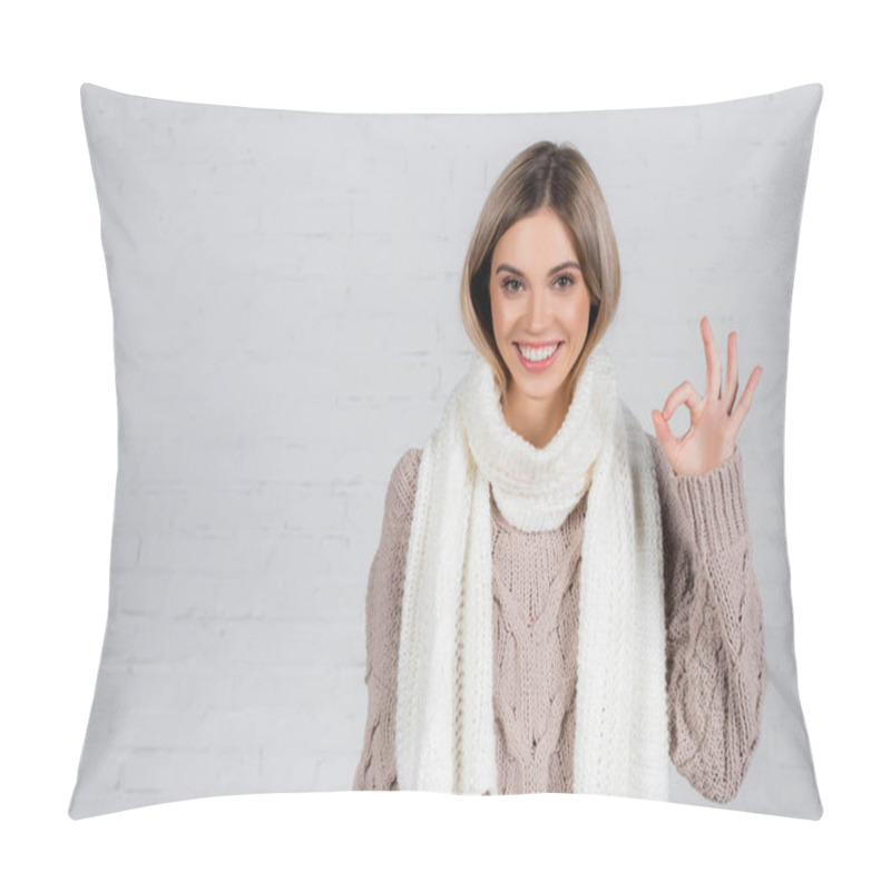 Personality  Smiling Woman In Knitwear Showing Okay Gesture On White Background Pillow Covers