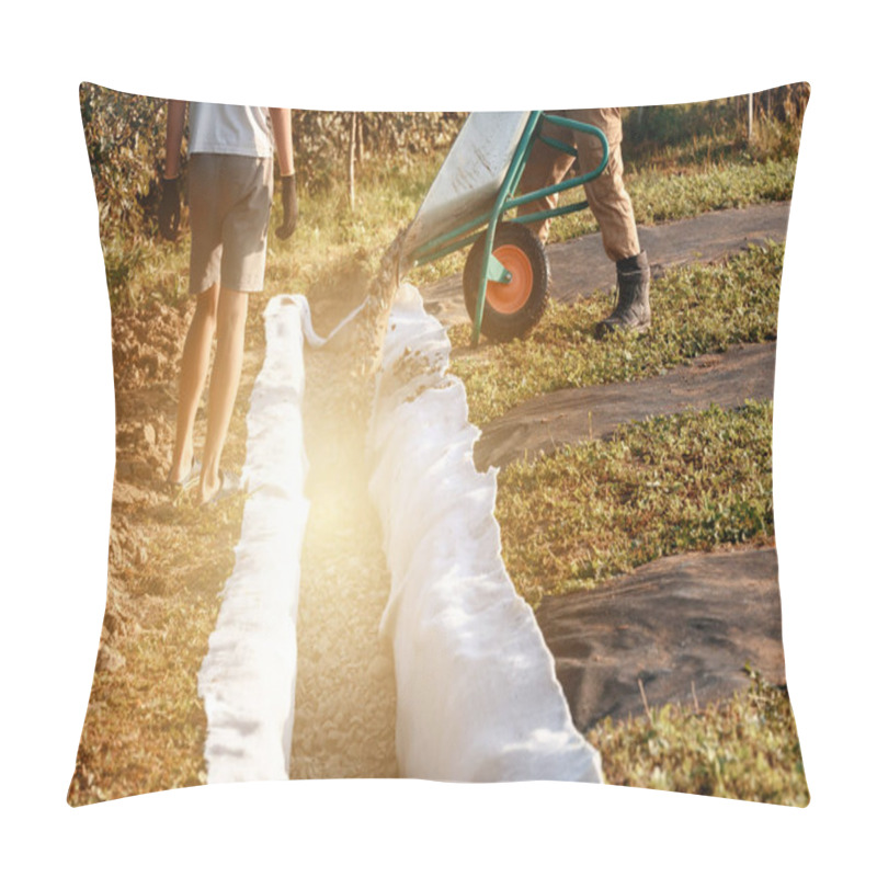 Personality  A Man Pours Rubble Crushed Stone From A Wheelbarrow Into A Trench. Drainage Works For Drainage Of Ground Water Around The Field. Pillow Covers