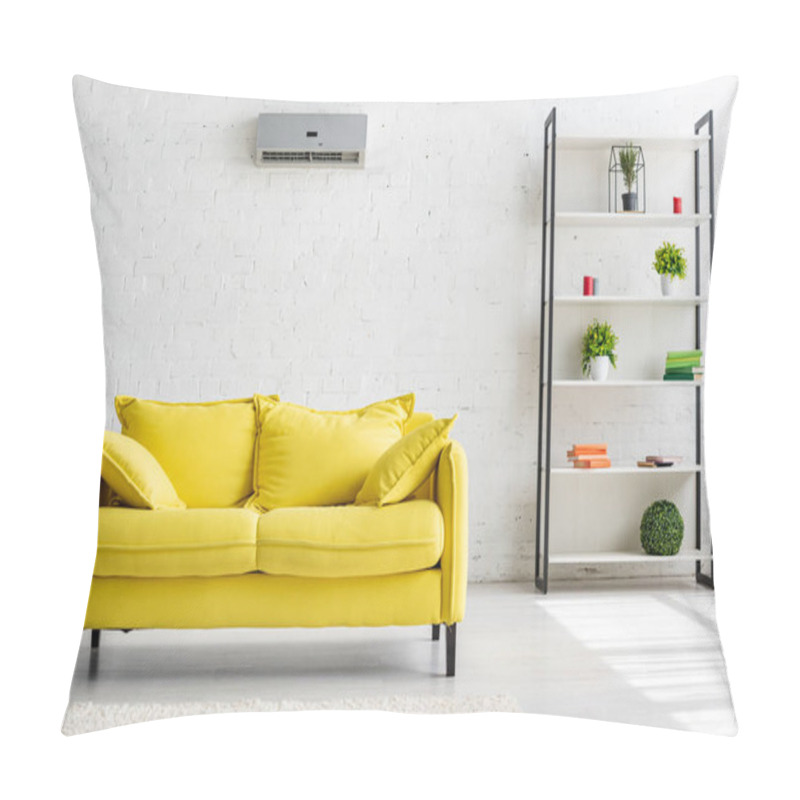 Personality  Spacious Living Room With Air Conditioner On White Wall, Yellow Sofa And Rack  Pillow Covers