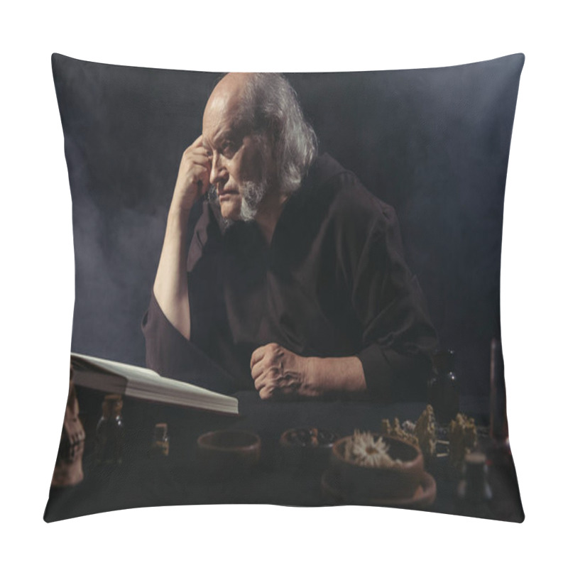 Personality  Medieval Alchemist Thinking Near Magic Cookbook And Dried Herbs On Black Background With Smoke Pillow Covers