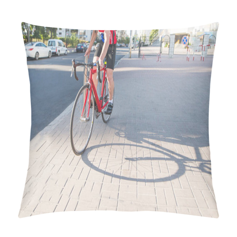 Personality  Professional Cyclist In Red Sportswear Is Standing On A Red Bicycle On The Sidewalk. Portrait Racing Driver Of A Cyclist. Sports Concept. Pillow Covers