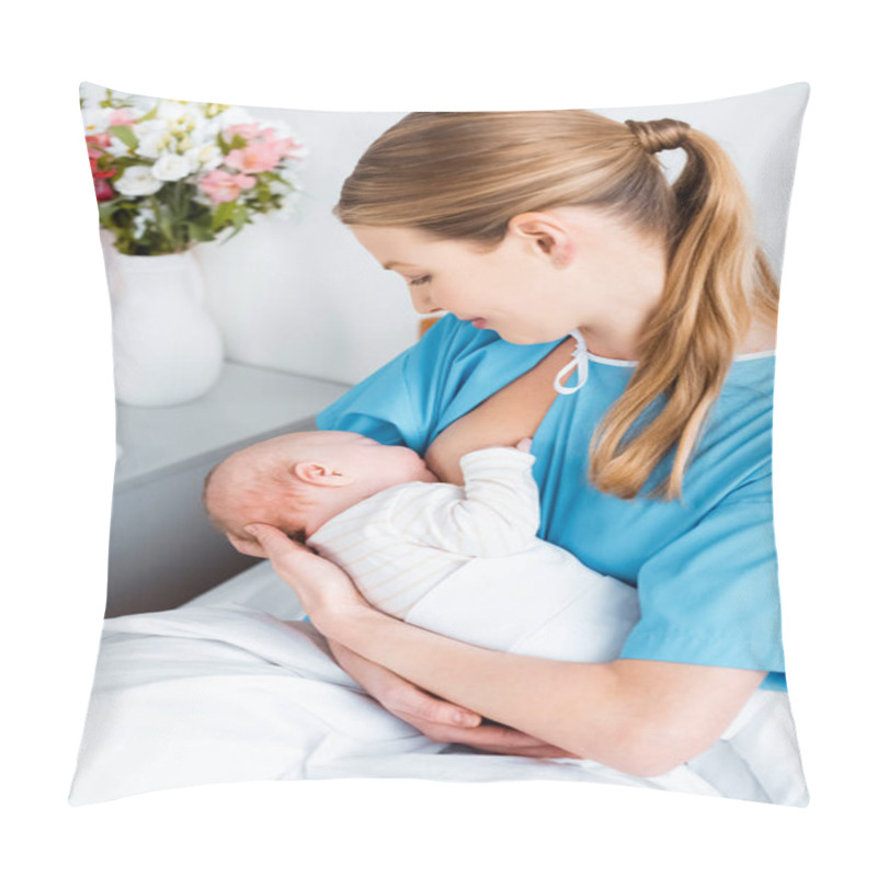 Personality  High Angle View Of Smiling Young Mother Sitting On Bed And Breastfeeding Baby In Hospital Room Pillow Covers