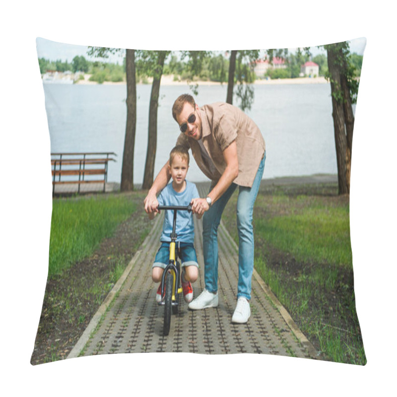 Personality  Father Helping Son Riding Small Bike On Road Near River Pillow Covers