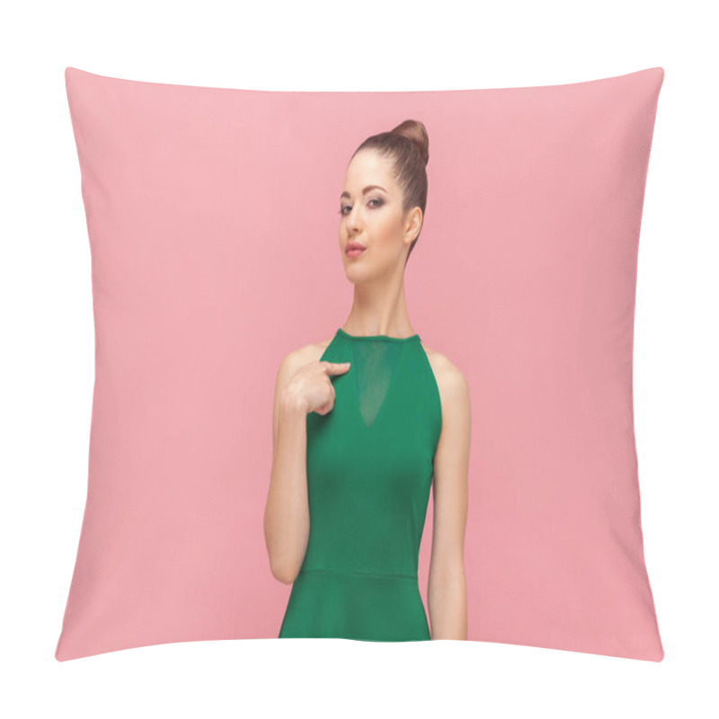 Personality  Portrait Of Self-confident Egoistic Woman With Bun Hairstyle Standing With Proud Facial Expression, Pointing Finger At Herself , Wearing Green Dress. Indoor Studio Shot Isolated On Pink Background. Pillow Covers