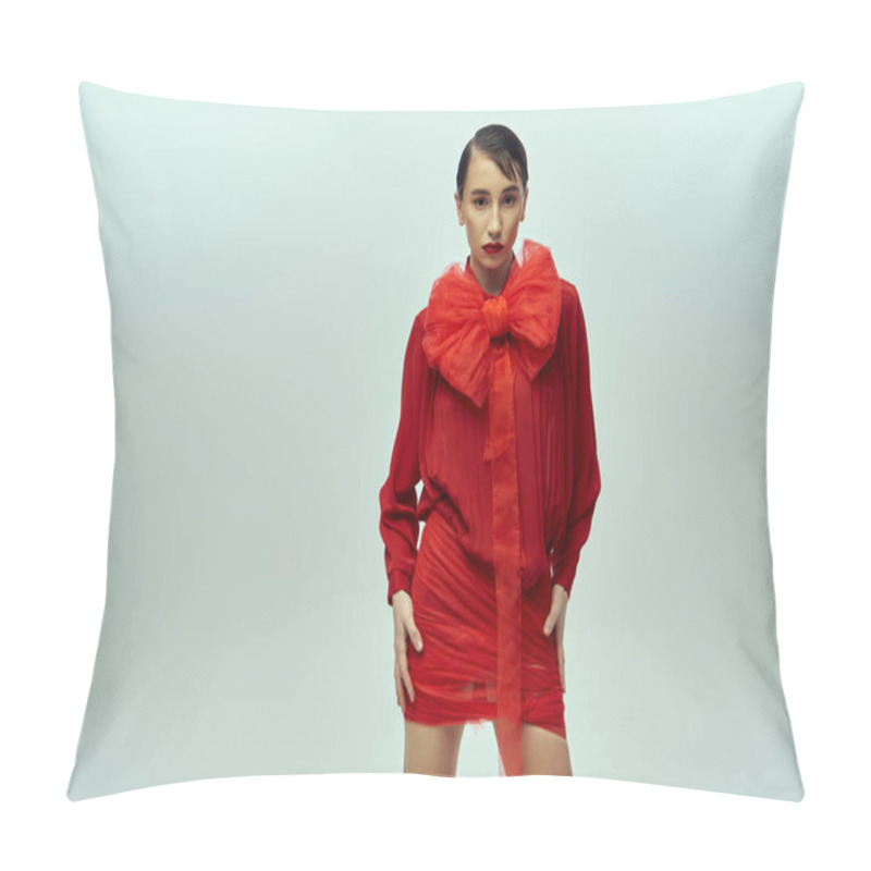 Personality  A Young Woman With Short Hair Models A Striking Red Ensemble With A Large Bow, Posing Against A Grey Backdrop. Pillow Covers