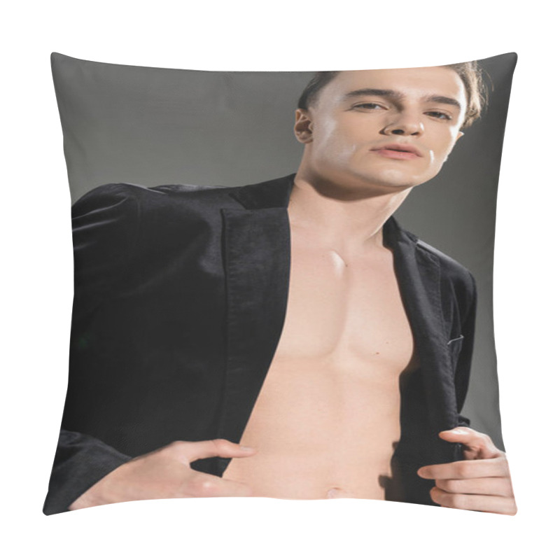 Personality  Low Angle View Of Provocative And Young Good Looking Man Wearing Black Silk Blazer On Shirtless Body While Standing And Looking At Camera On Grey Background Pillow Covers