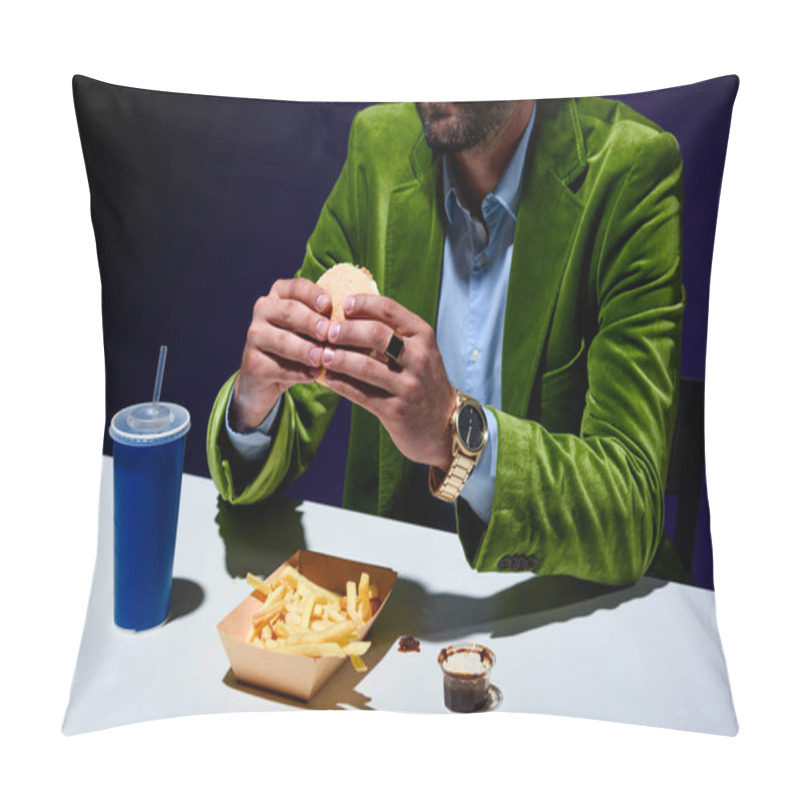 Personality  Cropped Shot Of Man In Velvet Jacket Eating Burger At Table With French Cries And Soda Drink With Blue Background Pillow Covers