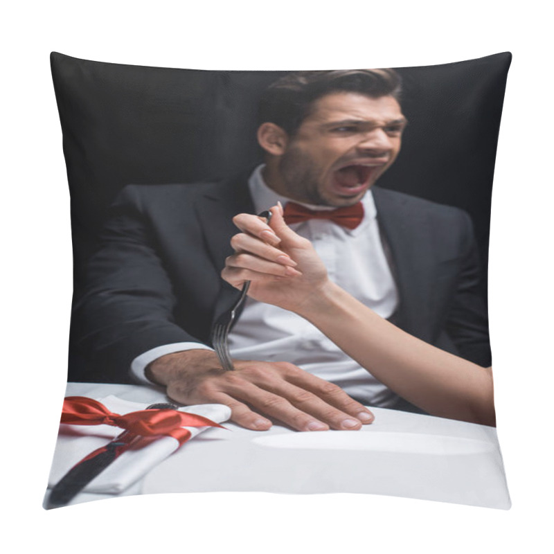 Personality  Selective Focus Of Woman Sticking Fork In Hand Of Screaming Boyfriend During Romantic Dinner Isolated On Black Pillow Covers