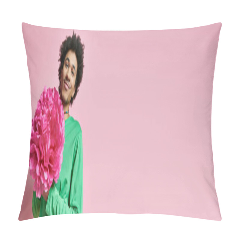 Personality  Cheerful African American Man With Curly Hair, In Green Shirt, Holding A Delicate Pink Flower On A Vibrant Pink Background. Pillow Covers