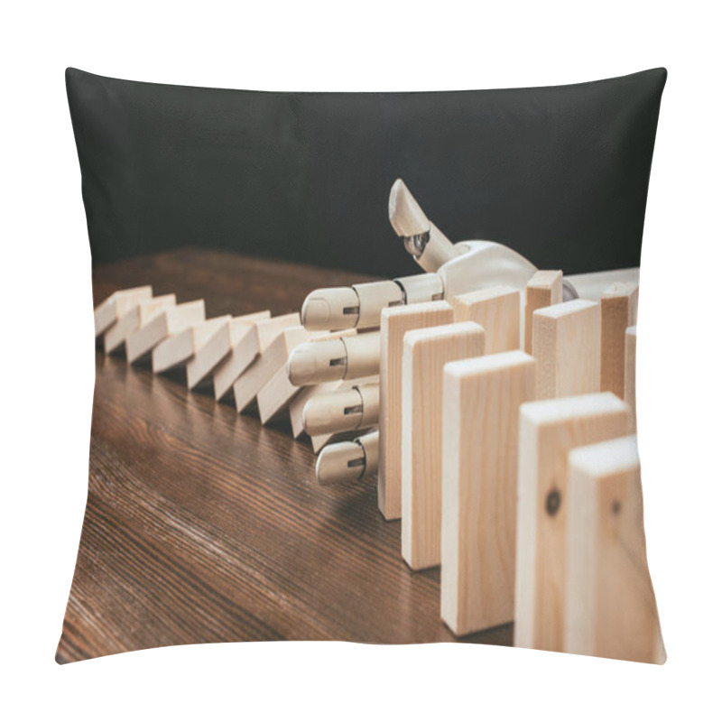 Personality  Robotic Hand Preventing Wooden Blocks From Falling On Desk Isolated On Black Pillow Covers