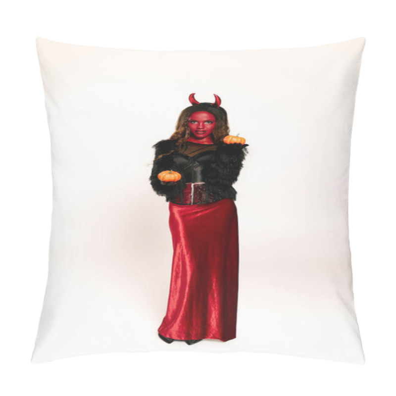 Personality  A Stunning Woman Dressed In A Devil Costume Holds Two Pumpkins, Capturing The Halloween Spirit. Pillow Covers