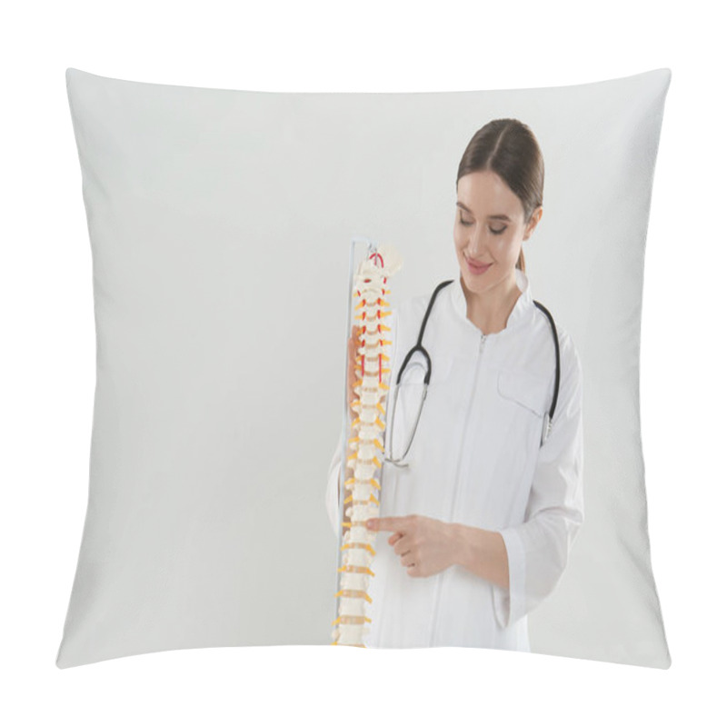 Personality  Female Orthopedist With Human Spine Model Against Light Background. Space For Text Pillow Covers