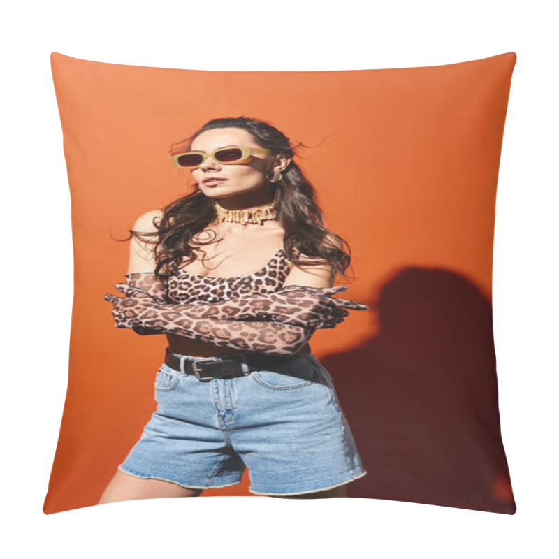 Personality  A Stylish Woman Wearing Leopard Print Top And Denim Shorts, Exuding Summertime Vibes, On An Orange Background. Pillow Covers