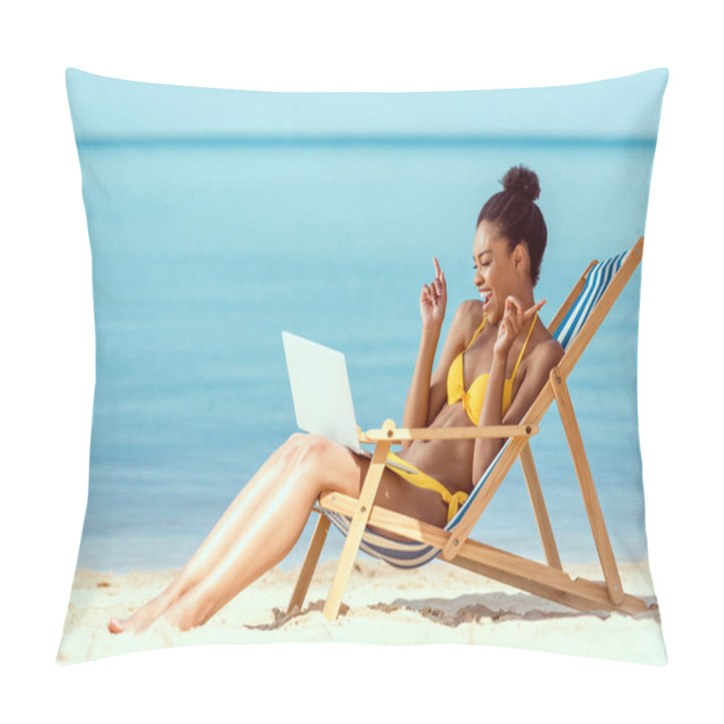 Personality  Smiling African American Woman Gesturing By Fingers And Communicating By Laptop While Sitting On Deck Chair On Sandy Beach  Pillow Covers