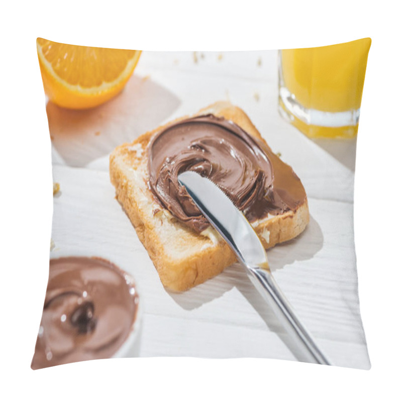 Personality  Selective Focus Of Toast With Chocolate Cream Near Knife And Half Of Orange On White  Pillow Covers