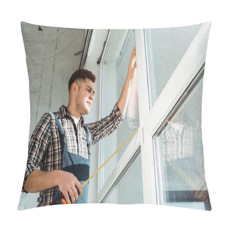 Personality  Low Angle View Of Installer Standing Near Windows And Holding Measuring Tape Pillow Covers