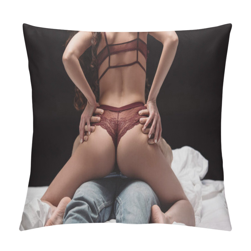 Personality  Back View Of Woman In Sexy Lingerie Sitting On Top Of Man In Bed Isolated On Black Pillow Covers