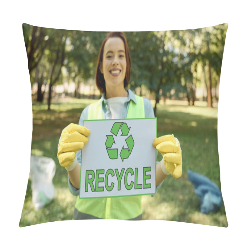 Personality  A Woman Wearing Gloves Holding A Sign That Says Recycle, Promoting Environmental Awareness And Sustainability In A Park Cleanup. Pillow Covers