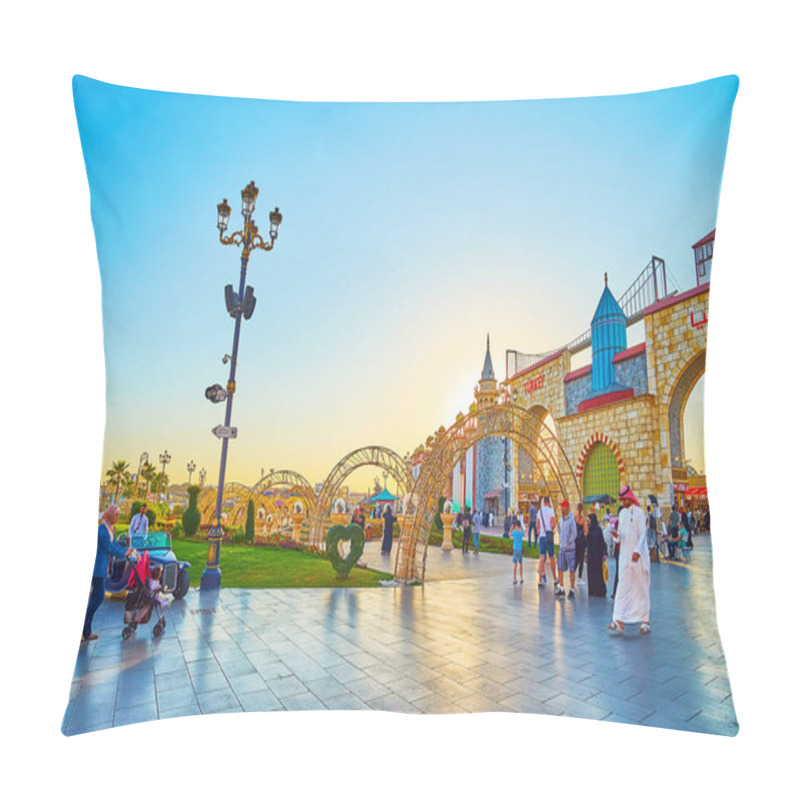 Personality  DUBAI, UAE - MARCH 5, 2020: The Sunset Sky Over The Grounds Of Global Village Dubai With Trade Pavilions, Arched Alley And Floral Installations On The Lawn, On March 5 In Dubai Pillow Covers