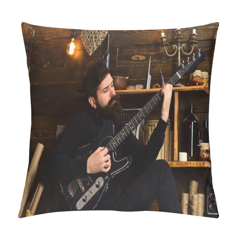 Personality  Best Weekend. Man With Beard Holds Black Electric Guitar. Man Bearded Musician Enjoy Evening With Bass Guitar, Wooden Background. Guy In Cozy Warm Atmosphere Play Relaxing Soul Music Pillow Covers