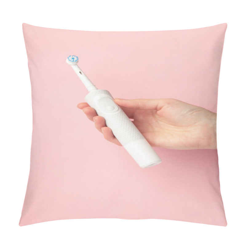 Personality  Woman Holding Electric Toothbrush On Pink Background. Top View Pillow Covers