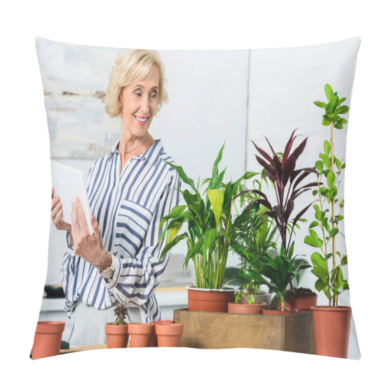 Personality  Smiling Senior Woman Holding Digital Tablet And Looking At Beautiful Houseplants In Pots Pillow Covers