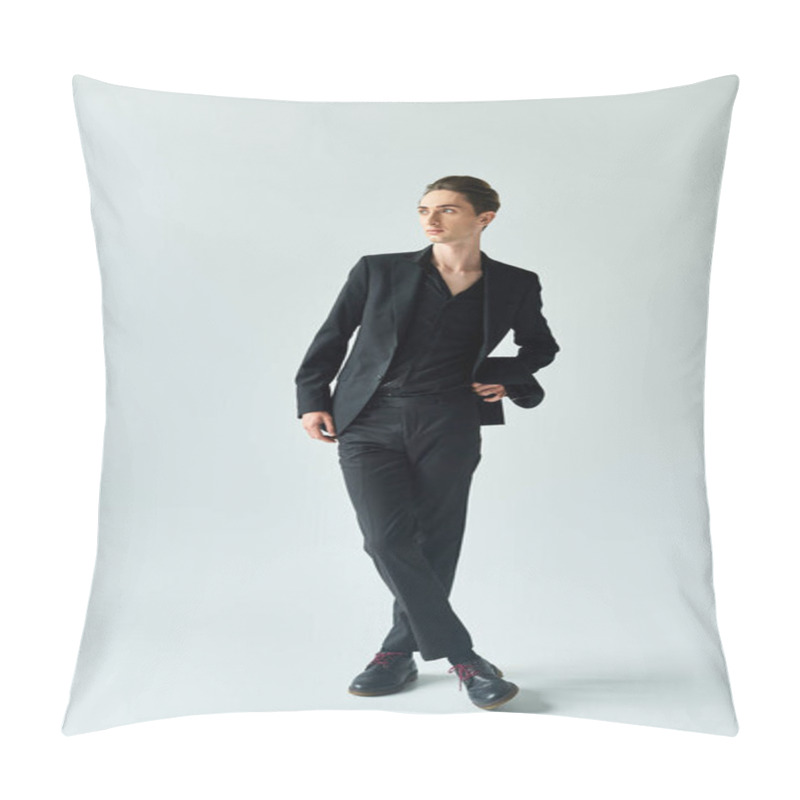 Personality  A Young Queer Man, Dressed In A Sleek Black Suit, Confidently Poses For The Camera In A Studio With A Grey Background. Pillow Covers