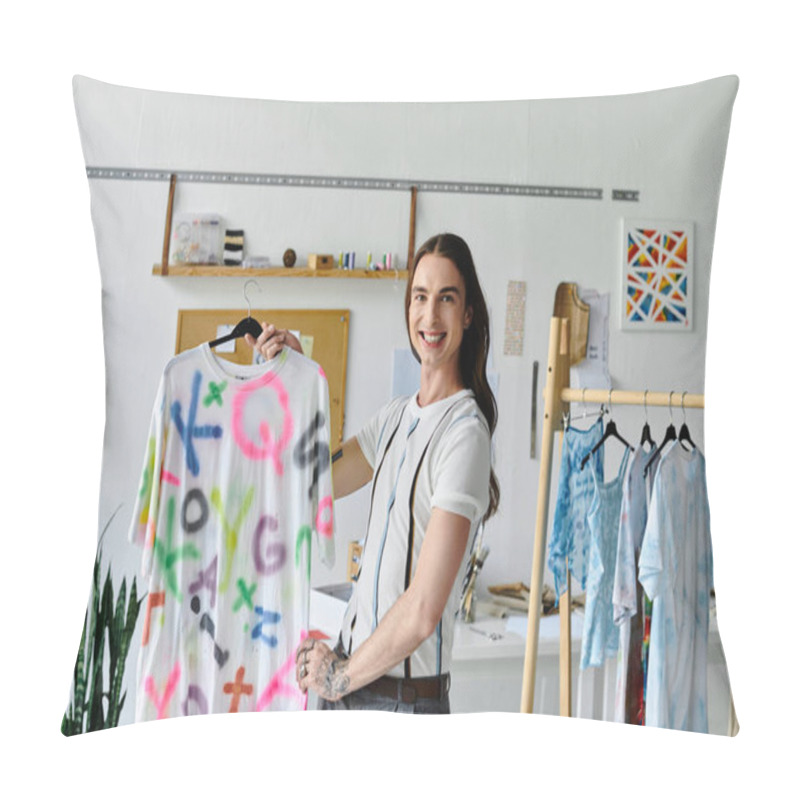 Personality  A Young Man Smiles Proudly As He Displays A Revitalized T-shirt In His Clothing Restoration Atelier, Showcasing His Passion For Sustainable Fashion. Pillow Covers