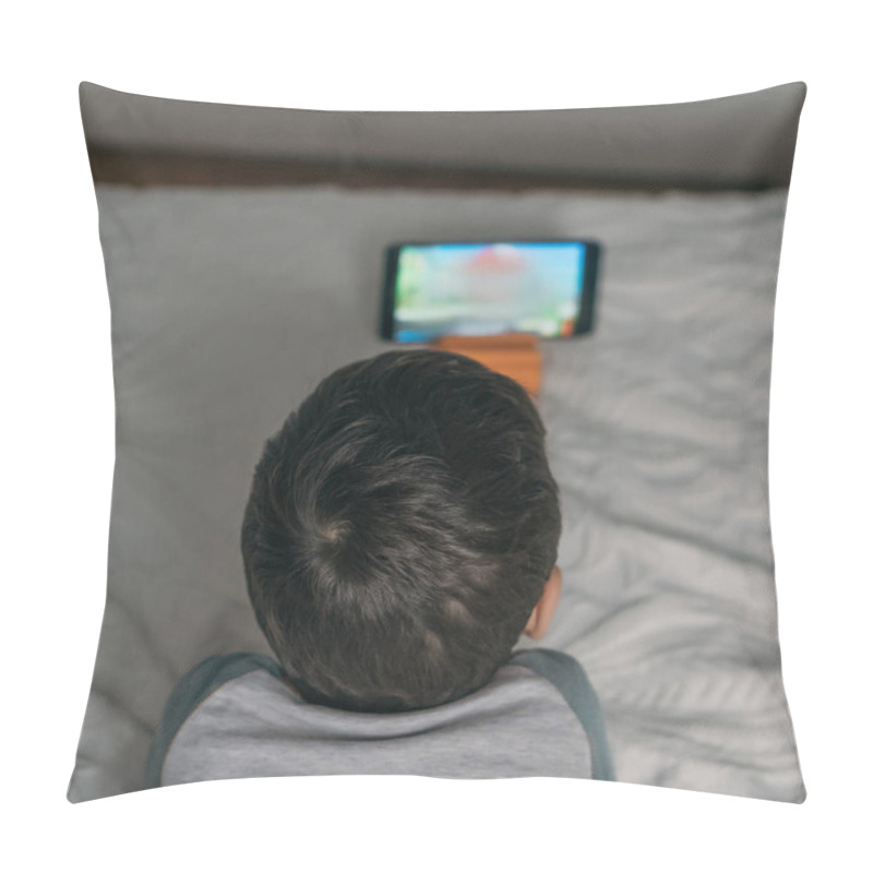 Personality  Overhead View Of Boy Watching Educational Cartoon On Smartphone While Lying On Bed Pillow Covers