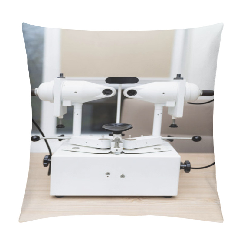 Personality  Eye Exam Lens Machine For Clinics. A High-tech Optical Lens Machine Is Set Up In A Clinic For Precise Eye Examinations And Lens Fitting For Patients. Pillow Covers