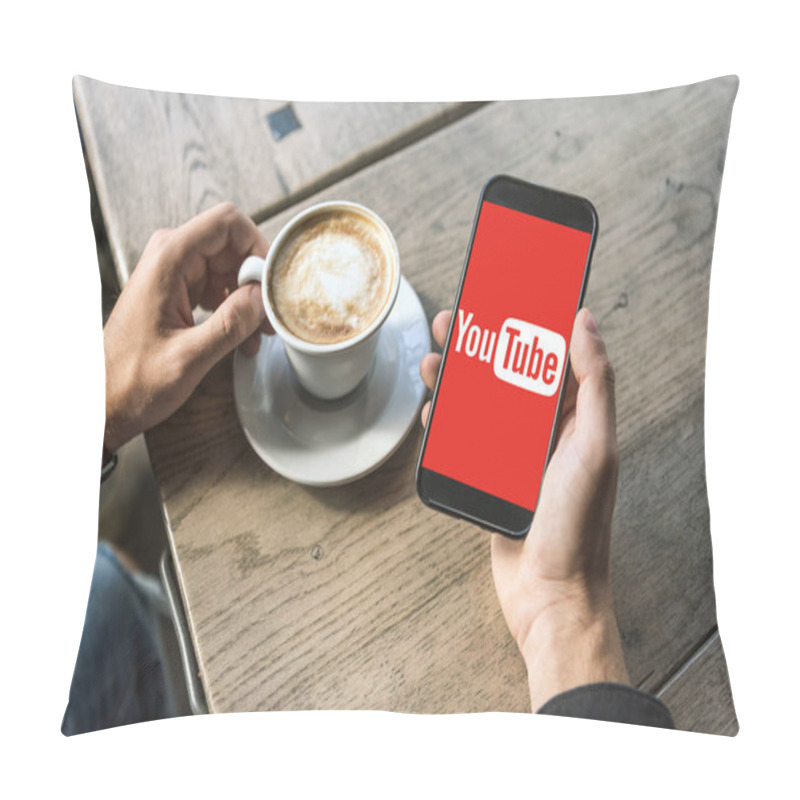 Personality  Cropped Shot Of Man With Cup Of Cappuccino Using Smartphone With Youtube Logo On Screen Pillow Covers